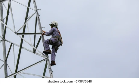 A technician climbing a
               communications tower to carry out installation work